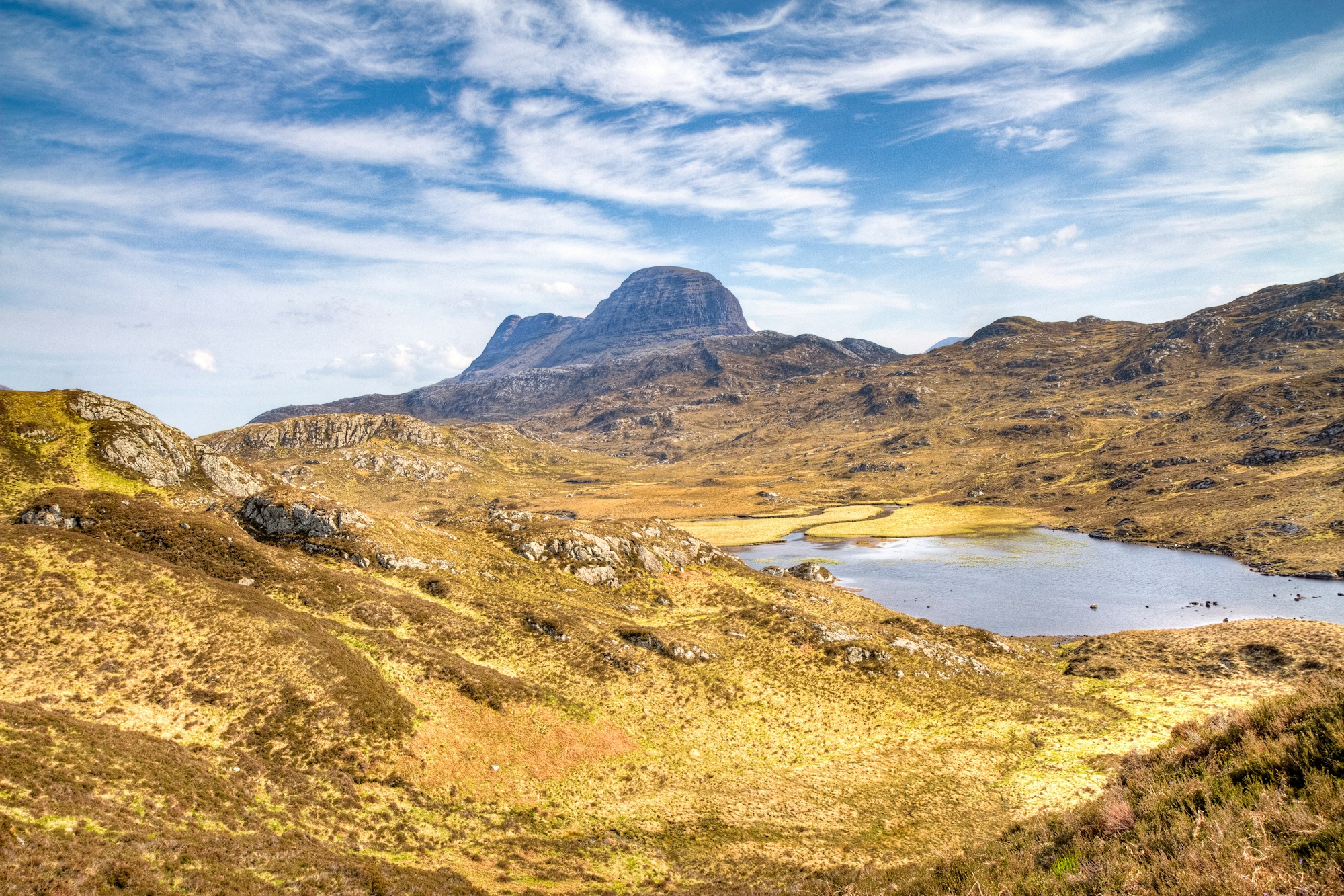 Suilven's sugar-loaf summit rising alone above the Assynt moorland